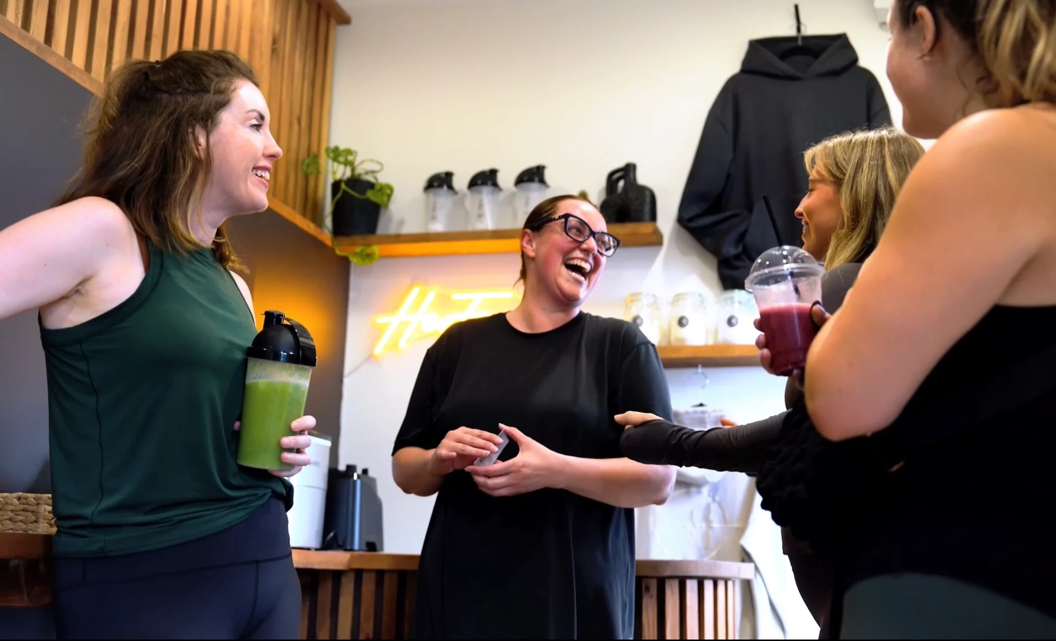 Her Fitness trainer with members in Her Fuel bar